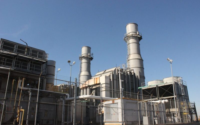 Peaker plant facility against a daytime sky.