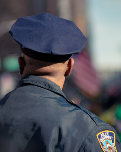 A police officer with his back turned.